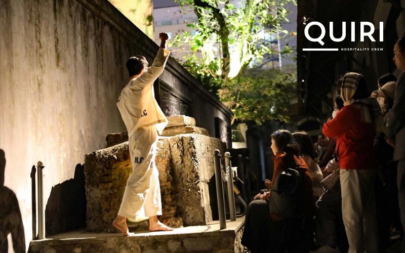 Discover historical insights at Hoa Lo Prison exploring Hanoi at night.