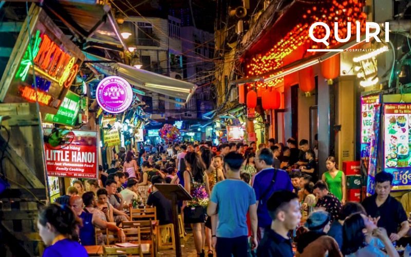 Enjoy Ta Hien Street nightlife sampling beer and local Vietnamese snacks.