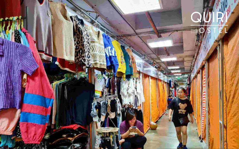 Curious shoppers explore varied goods inside this classic hanoi market zone