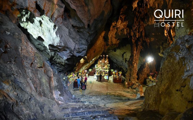 Pilgrims come seeking blessings in the sacred chambers of Huong Tich Cave.