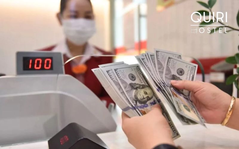 Person exchanging money at counter